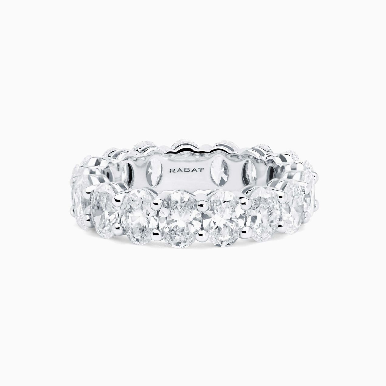 White gold wedding band ring with oval cut diamonds