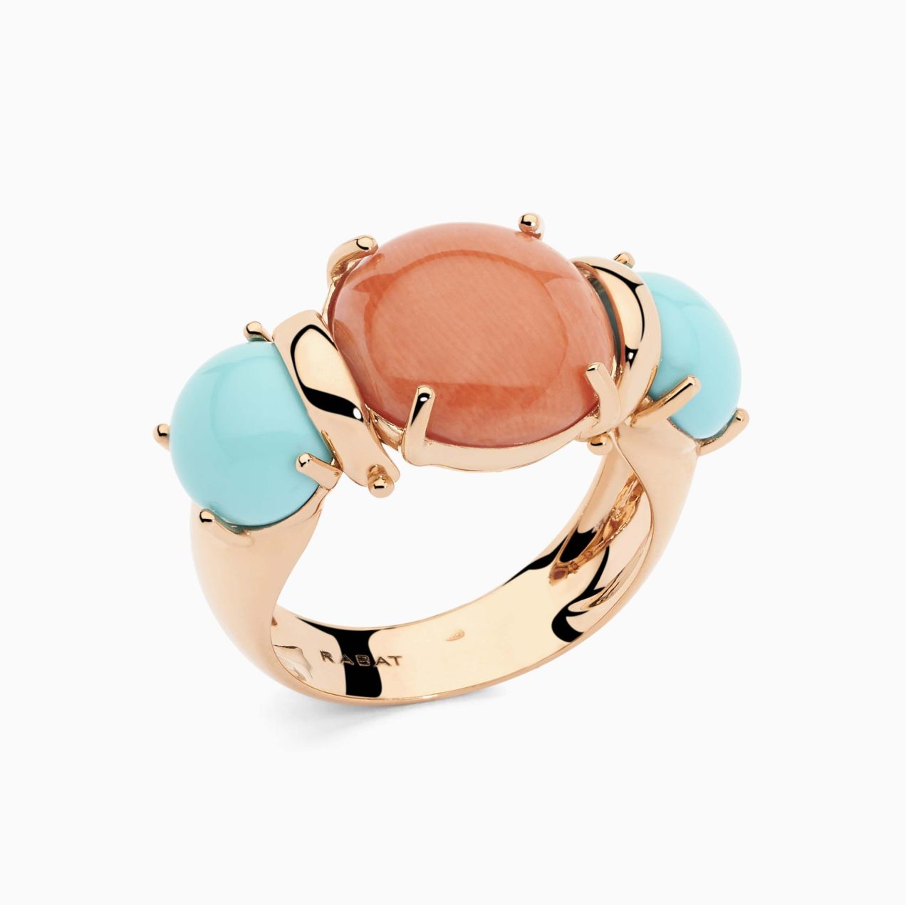 Rose Gold with a coral gem in the center and turquoise on the side ring