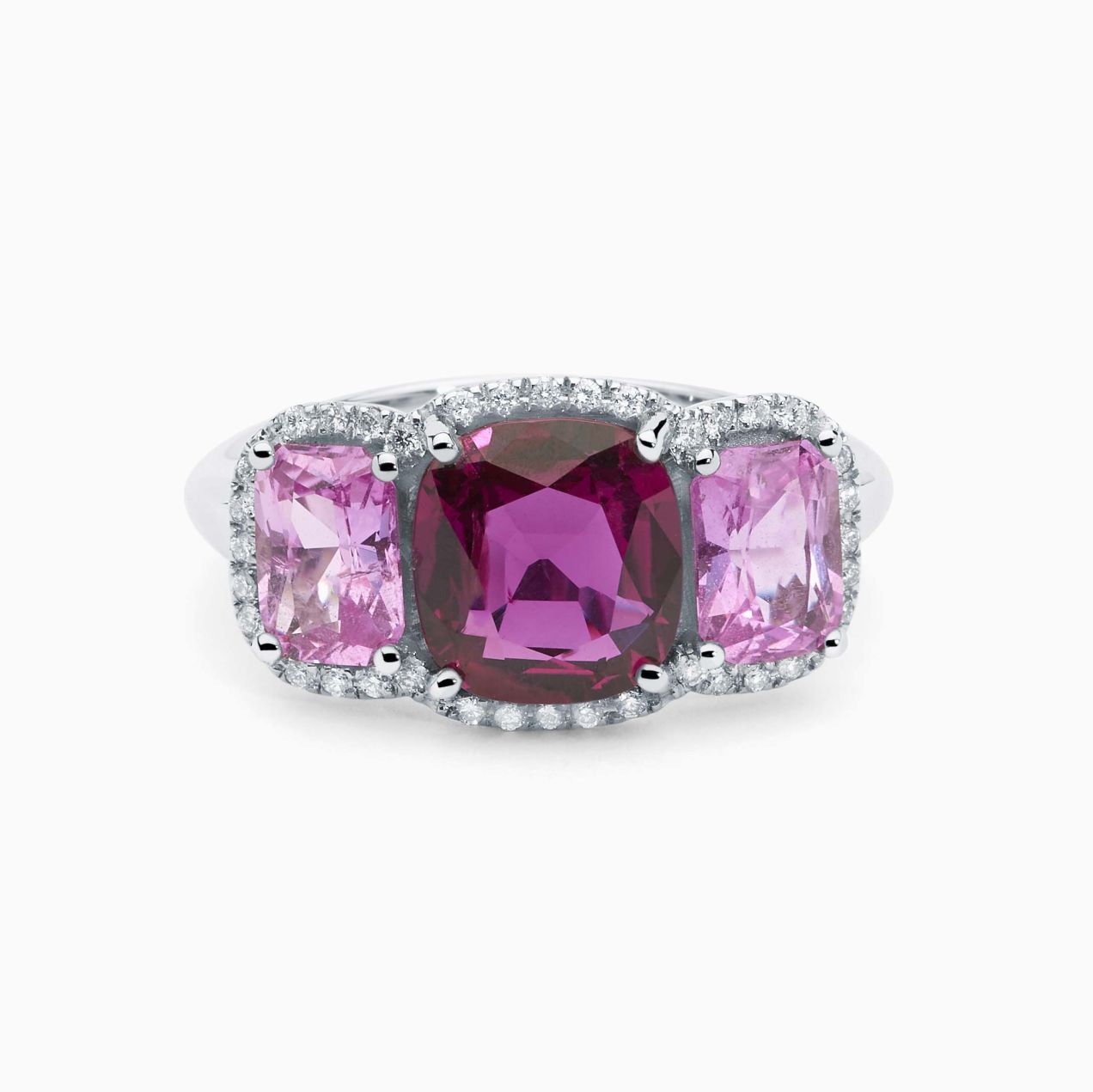 White gold with a ruby in the center and sapphires in the side solitaire ring