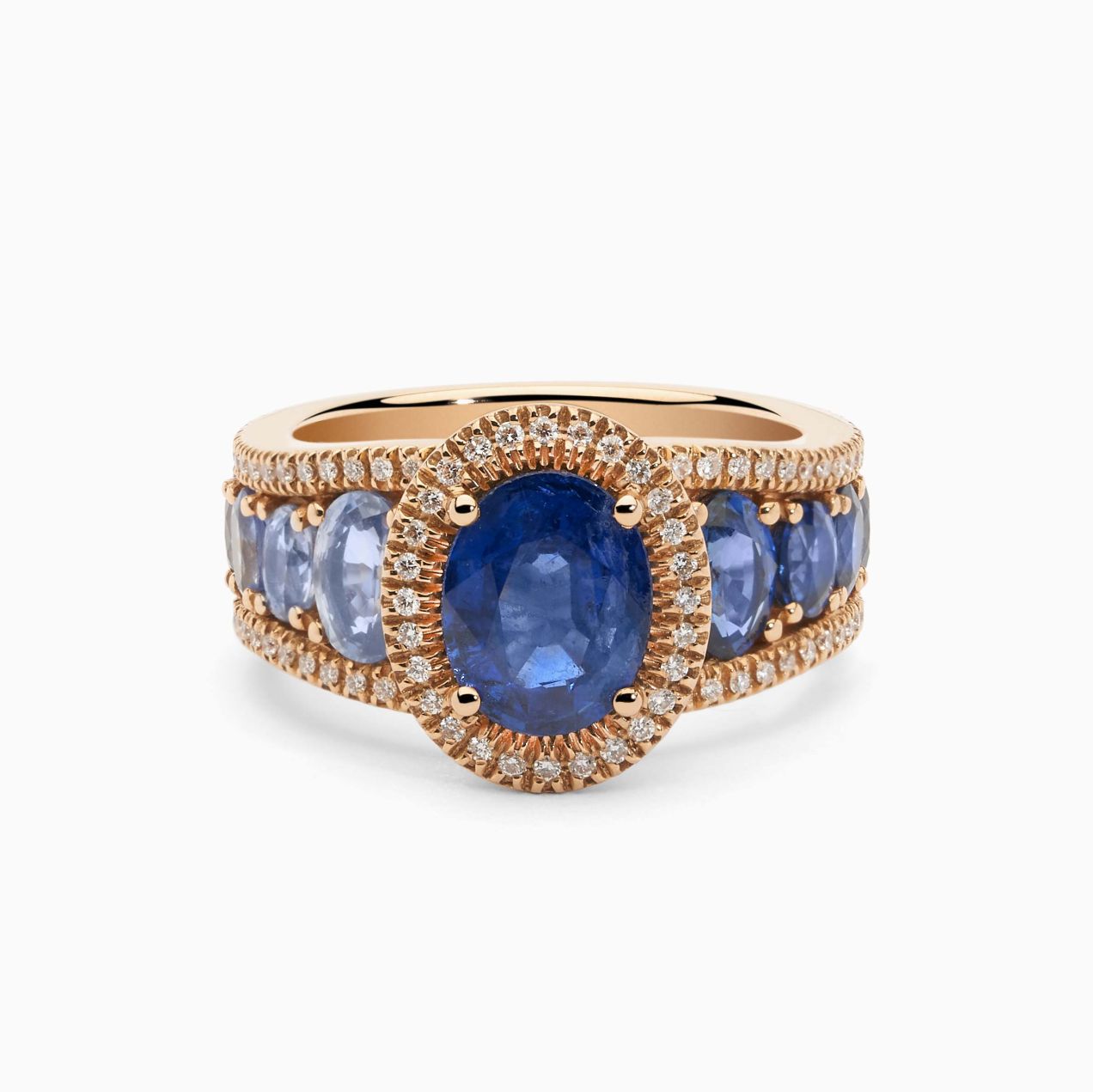 Rose gold ring with central blue sapphire and blue sapphire band