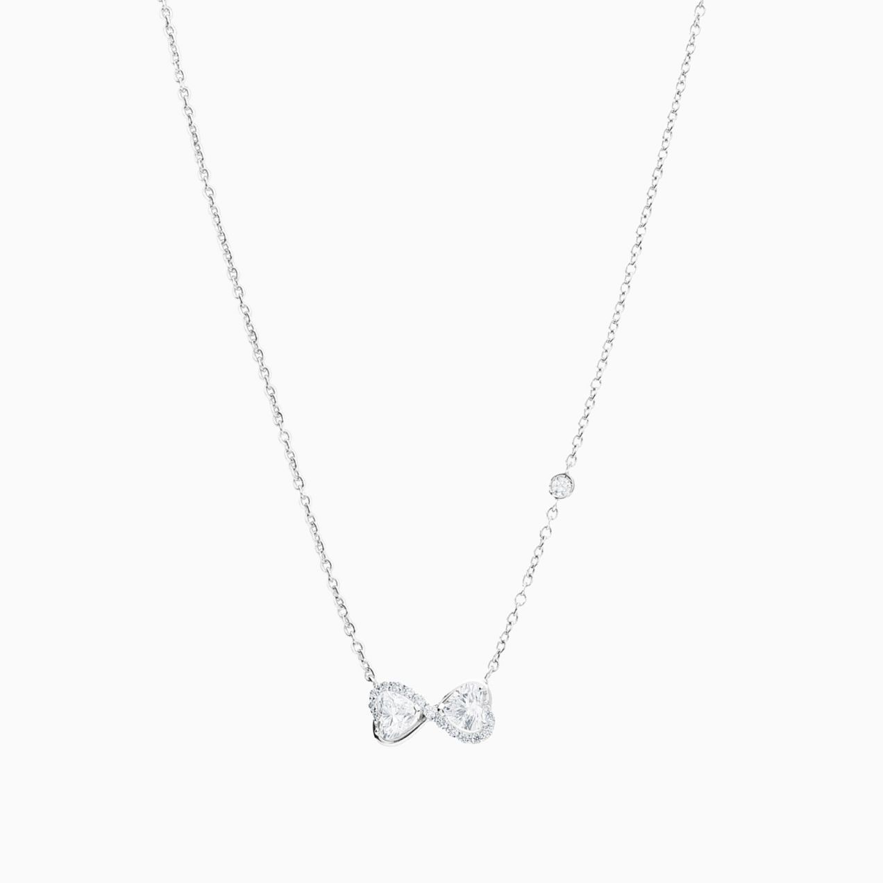 Infinity symbol pendant in white gold with heart-cut diamonds and diamonds