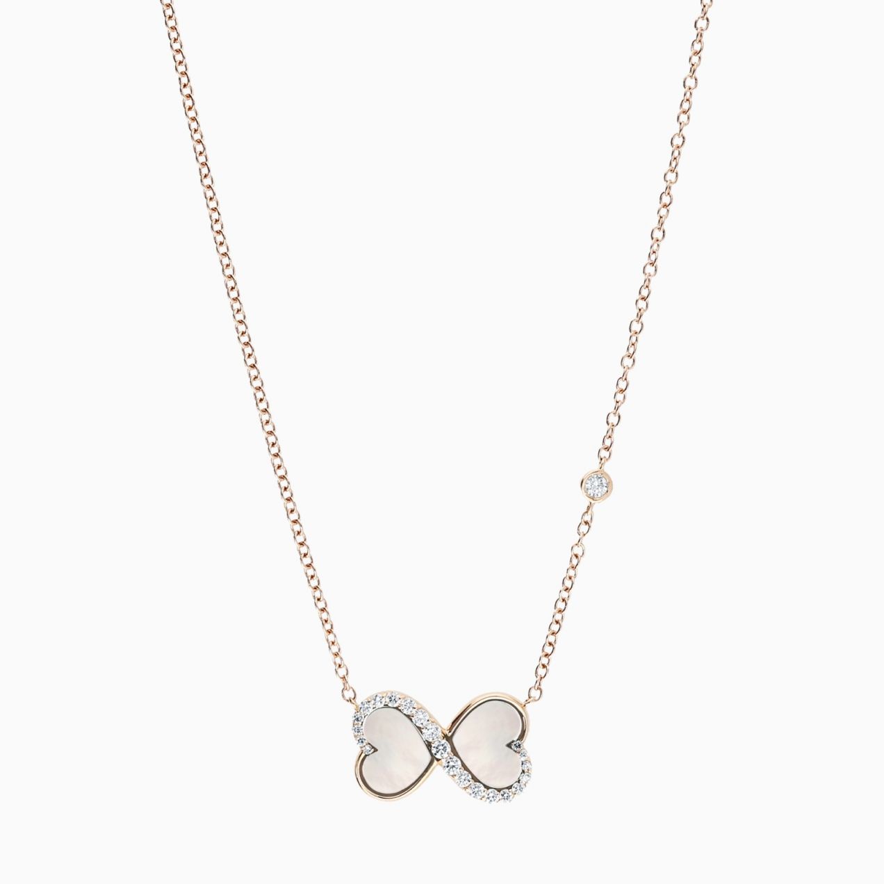 Infinity symbol pendant in rose gold with heart-cut mother of pearl and diamonds